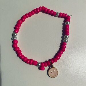 Pink Beaded Bracelet with Smiley Charm